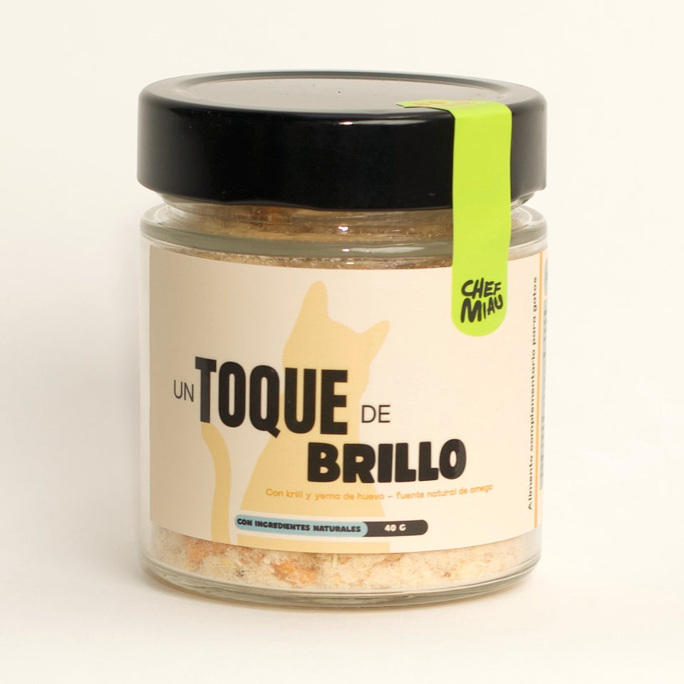 Tarro de cristal de Un Toque de Brillo sobre fondo claro.